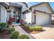 Inviting front entrance with lush landscaping and a paved walkway to the front door at 3023 Bent Creek Dr, Valrico, FL 33596