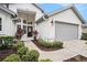 Inviting front exterior featuring a well-maintained lawn and an attached two-car garage at 3023 Bent Creek Dr, Valrico, FL 33596