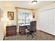 Home office featuring natural light, dark wood accents, built in storage, and a large window with a peaceful view at 3023 Bent Creek Dr, Valrico, FL 33596