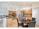 Modern kitchen featuring stainless steel appliances and a breakfast bar overlooking the dining area at 3023 Bent Creek Dr, Valrico, FL 33596