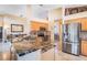 Well-equipped kitchen with granite countertops, stainless steel appliances, mosaic backsplash, and breakfast bar at 3023 Bent Creek Dr, Valrico, FL 33596