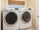 Modern laundry room equipped with a new, front-loading washer and dryer at 3023 Bent Creek Dr, Valrico, FL 33596