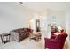 Airy living room with high ceilings, travertine floors and an abundance of natural light at 3023 Bent Creek Dr, Valrico, FL 33596