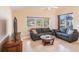 Comfortable living room with large window overlooking the outdoor patio at 3023 Bent Creek Dr, Valrico, FL 33596