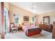 Spacious main bedroom with vaulted ceiling, ceiling fan, carpet, and view to the backyard at 3023 Bent Creek Dr, Valrico, FL 33596