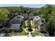 Aerial view of townhomes with lush landscaping and well-maintained yards at 3078 Pointer Dr, Palm Harbor, FL 34683