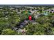Aerial view of the neighborhood with trees and parking at 3078 Pointer Dr, Palm Harbor, FL 34683