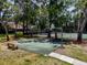 A look at the on-site community basketball court with mature tree coverage at 3078 Pointer Dr, Palm Harbor, FL 34683