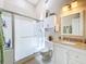 This bathroom features a shower and vanity with granite counters, with tile floors at 3078 Pointer Dr, Palm Harbor, FL 34683