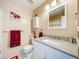 This bathroom has a combination shower and tub, with tile floors and granite countertops at 3078 Pointer Dr, Palm Harbor, FL 34683