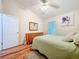 Bedroom with wood flooring, natural light, dresser, and closet at 3078 Pointer Dr, Palm Harbor, FL 34683