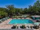 Beautiful community pool with plenty of seating and lounge options at 3078 Pointer Dr, Palm Harbor, FL 34683