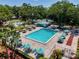 An overhead shot of the large, rectangular community pool and lounge area at 3078 Pointer Dr, Palm Harbor, FL 34683