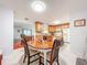 Dining area leading to the kitchen, creating an ideal space for casual meals and entertaining at 3078 Pointer Dr, Palm Harbor, FL 34683