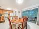 Cozy dining room with a view of the outdoor patio, perfect for enjoying meals with a garden view at 3078 Pointer Dr, Palm Harbor, FL 34683
