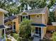 Two-story home with a manicured lawn and charming details at 3078 Pointer Dr, Palm Harbor, FL 34683