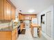 Open kitchen with granite countertops, tile backsplash, and a center island with seating at 3078 Pointer Dr, Palm Harbor, FL 34683