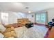 Inviting living space with hardwood floors, stairs to the second floor, and ample natural light at 3078 Pointer Dr, Palm Harbor, FL 34683