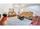 Cozy living room with comfortable sofas, staircase access and an open floor plan at 3078 Pointer Dr, Palm Harbor, FL 34683
