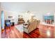 Open-concept living area featuring hardwood floors, ceiling fan, and seamless flow at 3078 Pointer Dr, Palm Harbor, FL 34683
