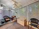 Cozy sunroom with a ceiling fan, neutral carpet, and various seating options at 3078 Pointer Dr, Palm Harbor, FL 34683