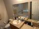 Bathroom featuring a vanity with a sink and a large mirror, with toilet and tub in the background at 3132 Royal Tuscan Ln, Valrico, FL 33594