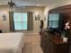Bright and airy bedroom with a large dresser and decor at 3132 Royal Tuscan Ln, Valrico, FL 33594