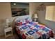 Nautical-themed bedroom with side tables and nautical-patterned bed at 3132 Royal Tuscan Ln, Valrico, FL 33594