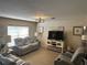 The living room features neutral tones, natural light, and tasteful decor, creating a serene atmosphere at 3132 Royal Tuscan Ln, Valrico, FL 33594
