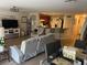 Open-concept living and dining area with modern decor, stainless appliances, and tile flooring at 3132 Royal Tuscan Ln, Valrico, FL 33594