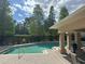 Community pool offers relaxation and recreation, surrounded by lush landscaping and seating at 3132 Royal Tuscan Ln, Valrico, FL 33594
