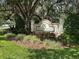 The welcoming Wedgewood community sign with lush landscaping, beautiful trees, and well-maintained greenery at 3132 Royal Tuscan Ln, Valrico, FL 33594