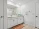Bathroom featuring double vanity, white cabinets, and neutral tones at 35029 Brackett Bnd, Zephyrhills, FL 33541