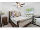 Cozy bedroom featuring a neutral color palette, a large window, and a soft carpet at 35029 Brackett Bnd, Zephyrhills, FL 33541