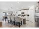 Modern kitchen featuring a breakfast bar with seating and stainless steel appliances at 35029 Brackett Bnd, Zephyrhills, FL 33541