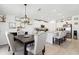 Open-concept kitchen and dining area features modern finishes and stylish furnishings at 35029 Brackett Bnd, Zephyrhills, FL 33541