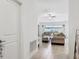 Bright and airy living room with tile floors and neutral-toned furniture at 35029 Brackett Bnd, Zephyrhills, FL 33541