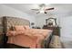 Comfortable bedroom featuring a tufted headboard and decorative accents at 35029 Brackett Bnd, Zephyrhills, FL 33541