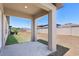 A covered patio overlooks the fenced backyard at 35029 Brackett Bnd, Zephyrhills, FL 33541