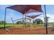 Community playground area with shade structure and climbing equipment for children at 35029 Brackett Bnd, Zephyrhills, FL 33541