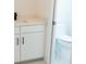 Bathroom featuring white cabinets, a modern sink and toilet at 3820 Pompano Se Dr, St Petersburg, FL 33705