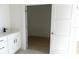 Bathroom featuring a vanity with modern fixtures and an open doorway leading to another room at 3820 Pompano Se Dr, St Petersburg, FL 33705