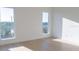 Sun-filled room featuring light-colored floors, white walls, and an open space perfect for furnishing at 3820 Pompano Se Dr, St Petersburg, FL 33705