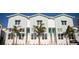 Charming exterior view of newly built modern townhomes with landscaped front yards at 3820 Pompano Se Dr, St Petersburg, FL 33705