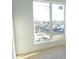 Bright interior view showcasing a large window with neighborhood views and natural light at 3820 Pompano Se Dr, St Petersburg, FL 33705
