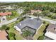 Overhead view of a home with a screened-in pool and well-maintained landscaping at 3982 Wellington Pkwy, Palm Harbor, FL 34685