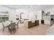 Open kitchen featuring a center island, modern appliances, and an adjacent dining area at 3982 Wellington Pkwy, Palm Harbor, FL 34685