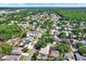 An aerial view of the neighborhood showcasing lush trees and sidewalks at 4101 Hollowtrail Dr, Tampa, FL 33624