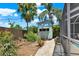 Charming backyard featuring a shed, lush landscaping, and a cozy ambiance for outdoor enjoyment at 4101 Hollowtrail Dr, Tampa, FL 33624