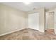 Neutral bedroom with tiled floors and a built in closet, providing a blank canvas for personalization at 4101 Hollowtrail Dr, Tampa, FL 33624